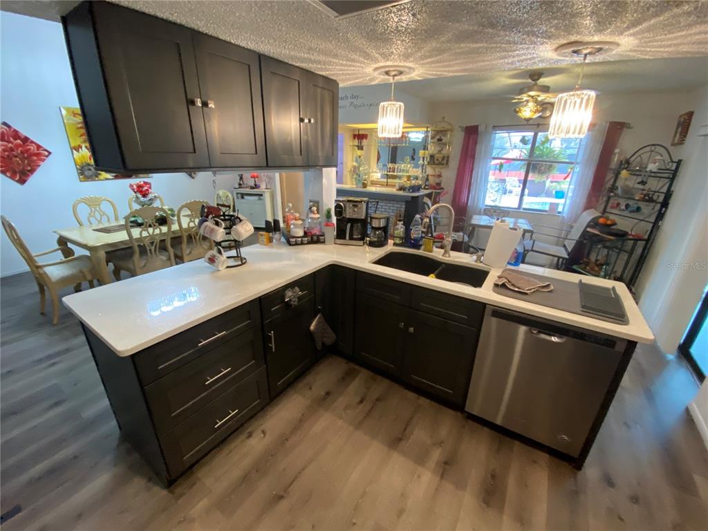 4100 Montano Avenue Spring Hill, FL 34609 - Photo 13 of 59 a kitchen with a sink cabinets and window