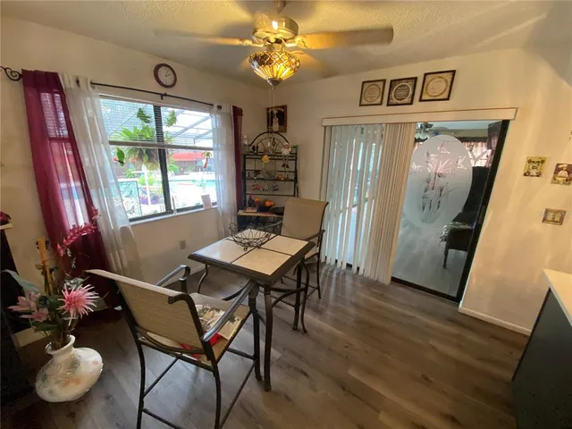 a dining room with furniture and window