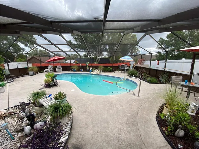 a view of a swimming pool with a patio
