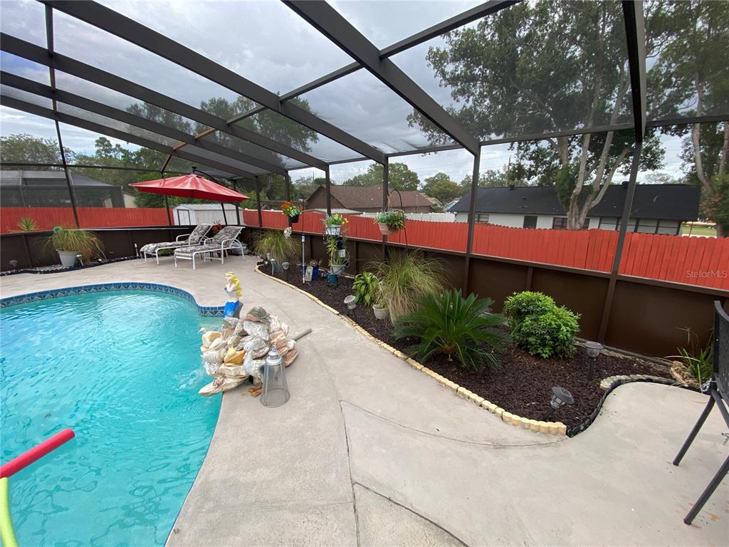 4100 Montano Avenue Spring Hill, FL 34609 - Photo 32 of 59 a view of a backyard with sitting area