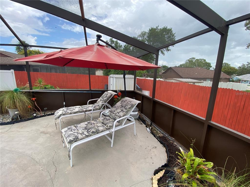 4100 Montano Avenue Spring Hill, FL 34609 - Photo 33 of 59 a balcony with furniture and a potted plant