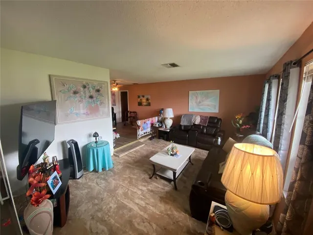 a white toilet sitting next to a small bathroom