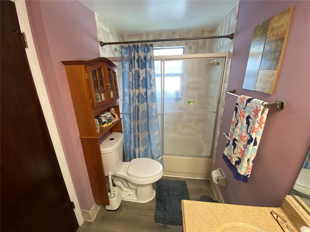 4100 Montano Avenue Spring Hill, FL 34609 - Photo 46 of 59 a bathroom with a shower and a toilet