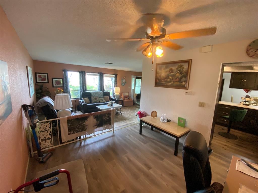4100 Montano Avenue Spring Hill, FL 34609 - Photo 8 of 59 a living room with furniture and a flat screen tv