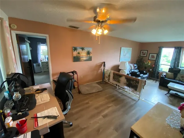 a kitchen with stainless steel appliances wooden cabinets and a stove top oven