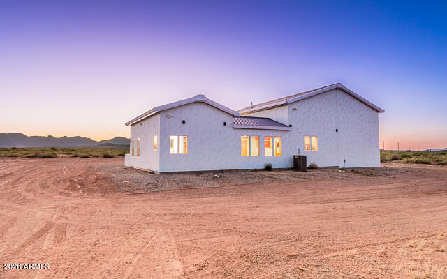 6233 West Airport Road Willcox, AZ 85643 - Photo 6 of 54 a view of a big house with a yard