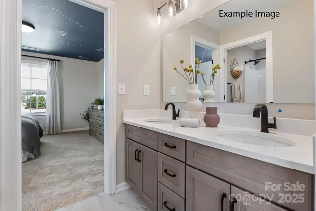 a bathroom with a double vanity sink a toilet and a mirror