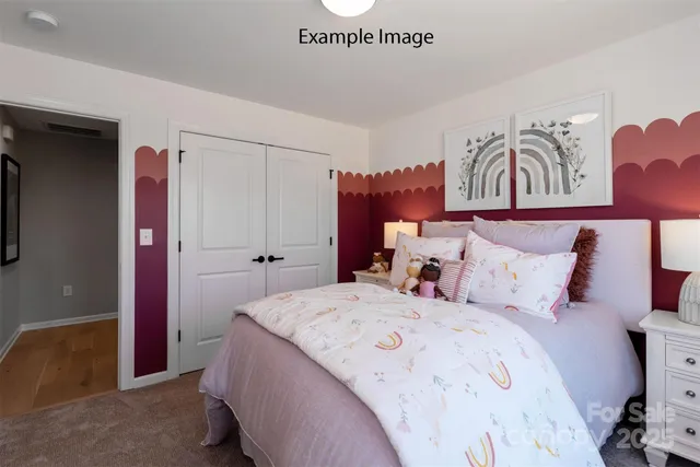 a bed room with a bed and a couch