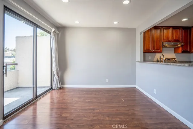 a view of a kitchen with a sink and a window