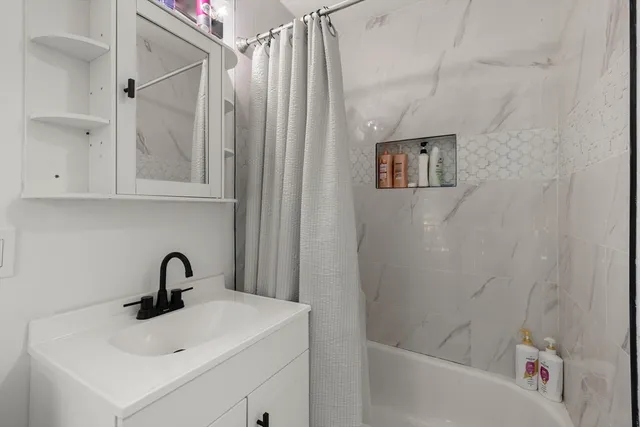 a bathroom with a sink and a bathtub