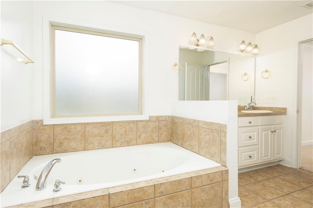8 Ridgebrook Drive Phenix City, AL 36869 - Photo 13 of 21 Full bath with vanity, a tub with jets, and tile patterned floors