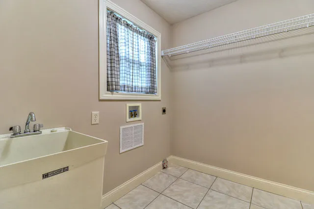 a bathroom with a sink and a window