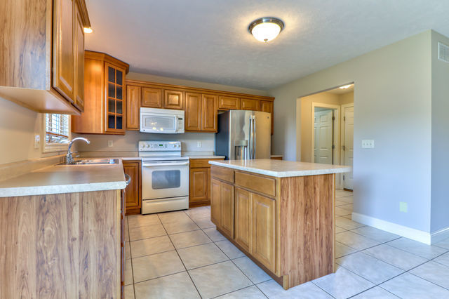 2515 St Andrews Road Urbana, IL 61802 - Photo 14 of 50 a kitchen with stainless steel appliances a sink and cabinets