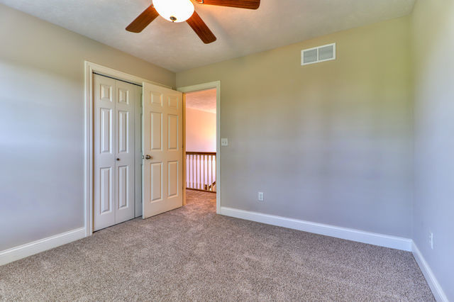 2515 St Andrews Road Urbana, IL 61802 - Photo 33 of 50 an empty room with chandelier fan