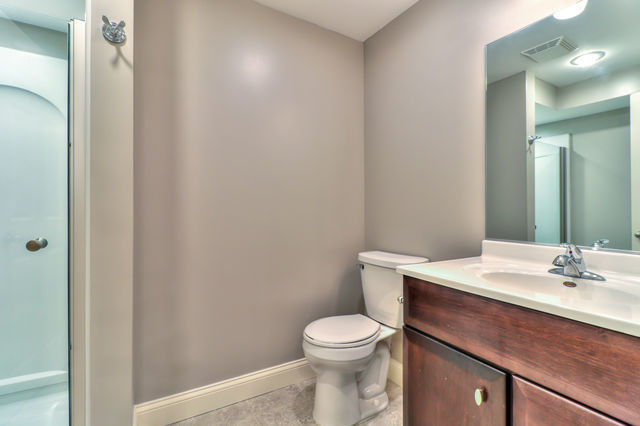 2515 St Andrews Road Urbana, IL 61802 - Photo 39 of 50 a bathroom with a sink a toilet and mirror