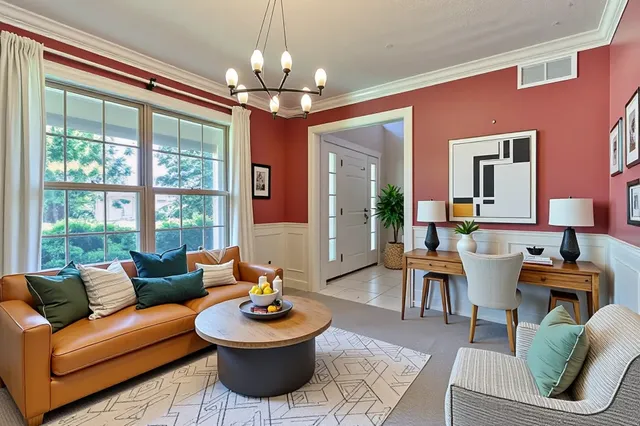 a living room with furniture and a chandelier