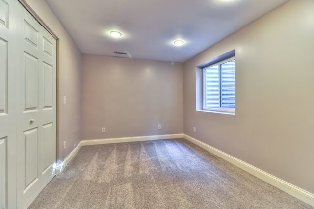 2515 St Andrews Road Urbana, IL 61802 - Photo 41 of 50 a view of an empty room with wooden floor and a window