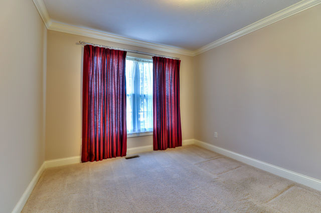 2515 St Andrews Road Urbana, IL 61802 - Photo 8 of 50 an empty room with red walls and a window