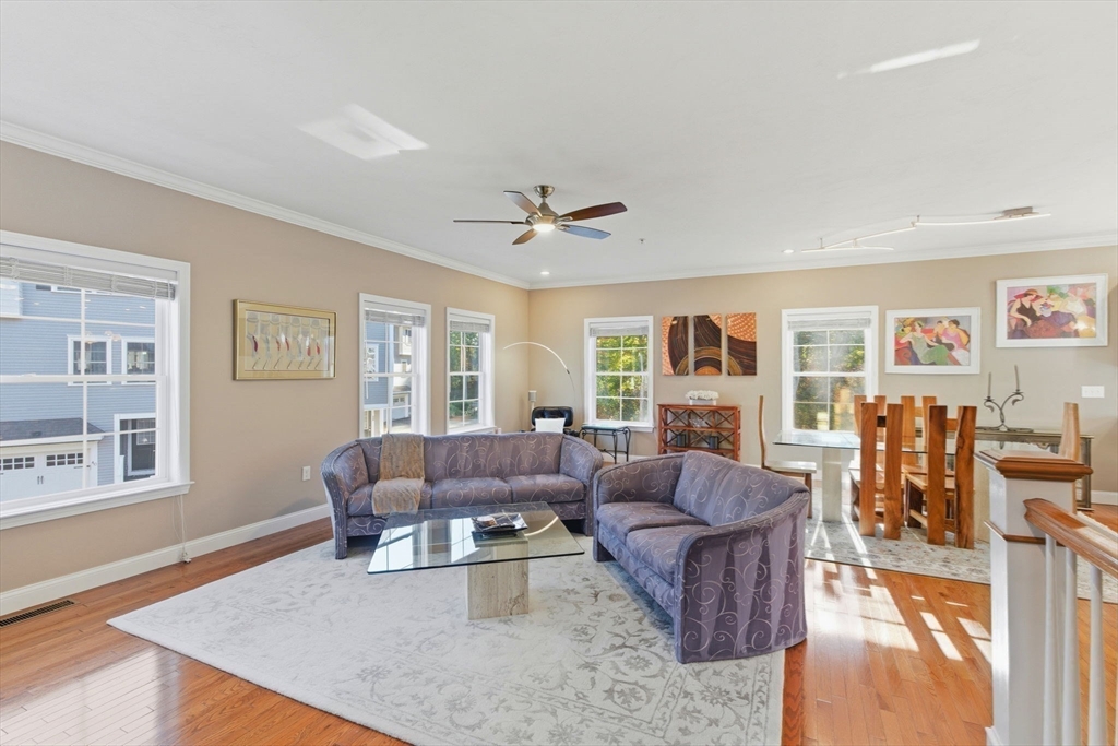 66 Compass Point, Unit 66 North Andover, MA 01845 - Photo 26 of 42 a living room with furniture and a large window