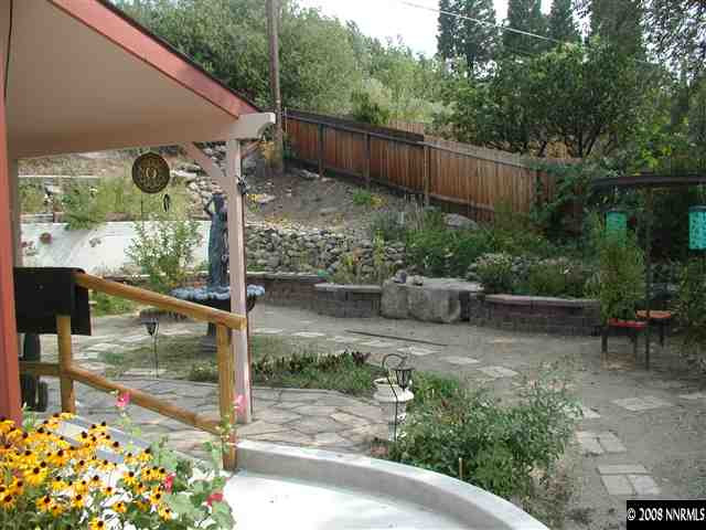1214 Secluded Circle Reno, NV 89509 - Photo 5 of 9 a view of a backyard