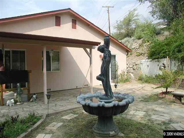 1214 Secluded Circle Reno, NV 89509 - Photo 8 of 9 a front view of a house with a yard