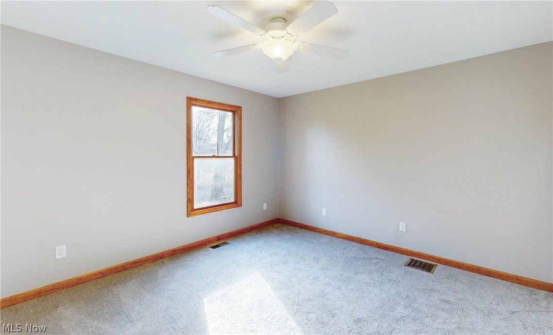 2081 Stroup Road Atwater, OH 44201 - Photo 41 of 48 Carpeted spare room with ceiling fan