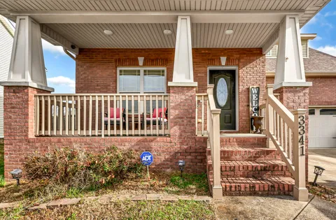 a view of a house with a small deck