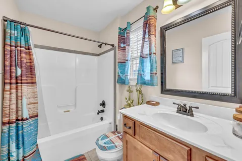 a bedroom with furniture and a chandelier