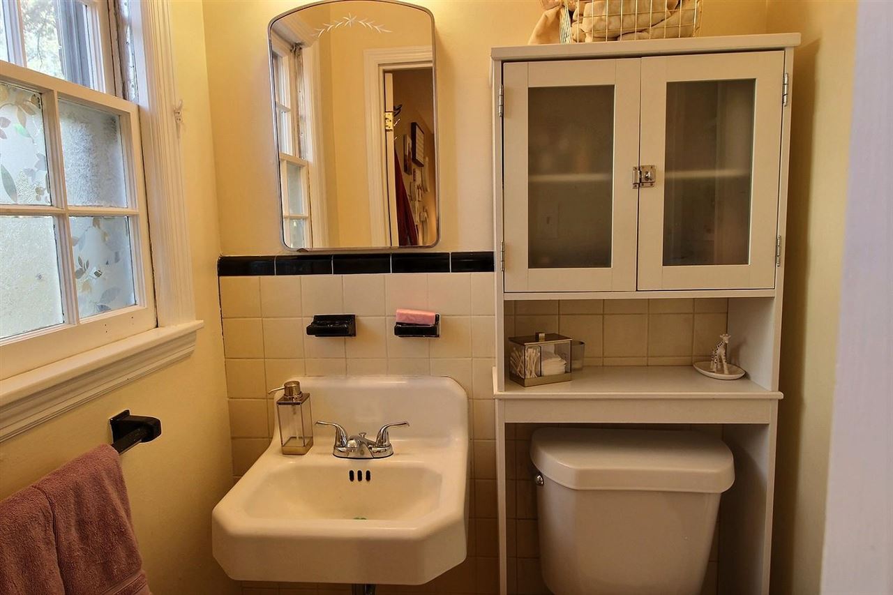 1654 Colonial Road Memphis, TN 38117 - Photo 5 of 14 a bathroom with a sink and a mirror