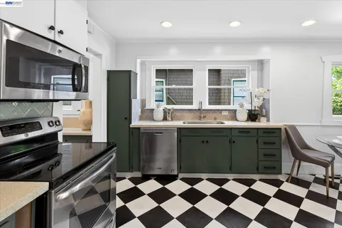 a kitchen with a sink stove and refrigerator
