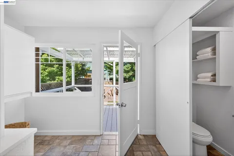 a view of entryway with wooden floor and window