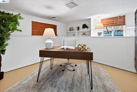a room with furniture and wooden floor