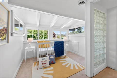 a view of a kitchen with furniture and windows
