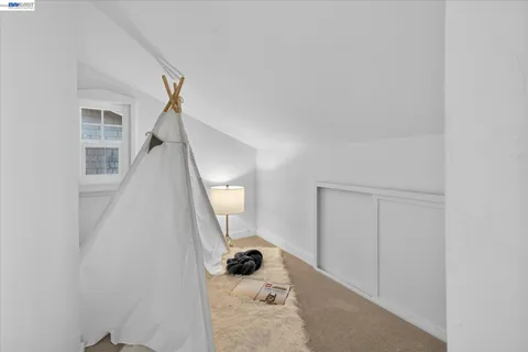 a view of a livingroom with wooden floor and a window