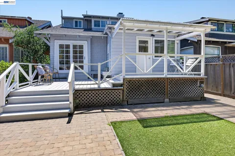 a view of a patio with a chairs and table in the patio