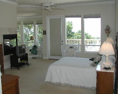 3941 Parker Hill Road Santa Rosa, CA 95404 - Photo 8 of 10 a spacious bedroom with a bed and large windows