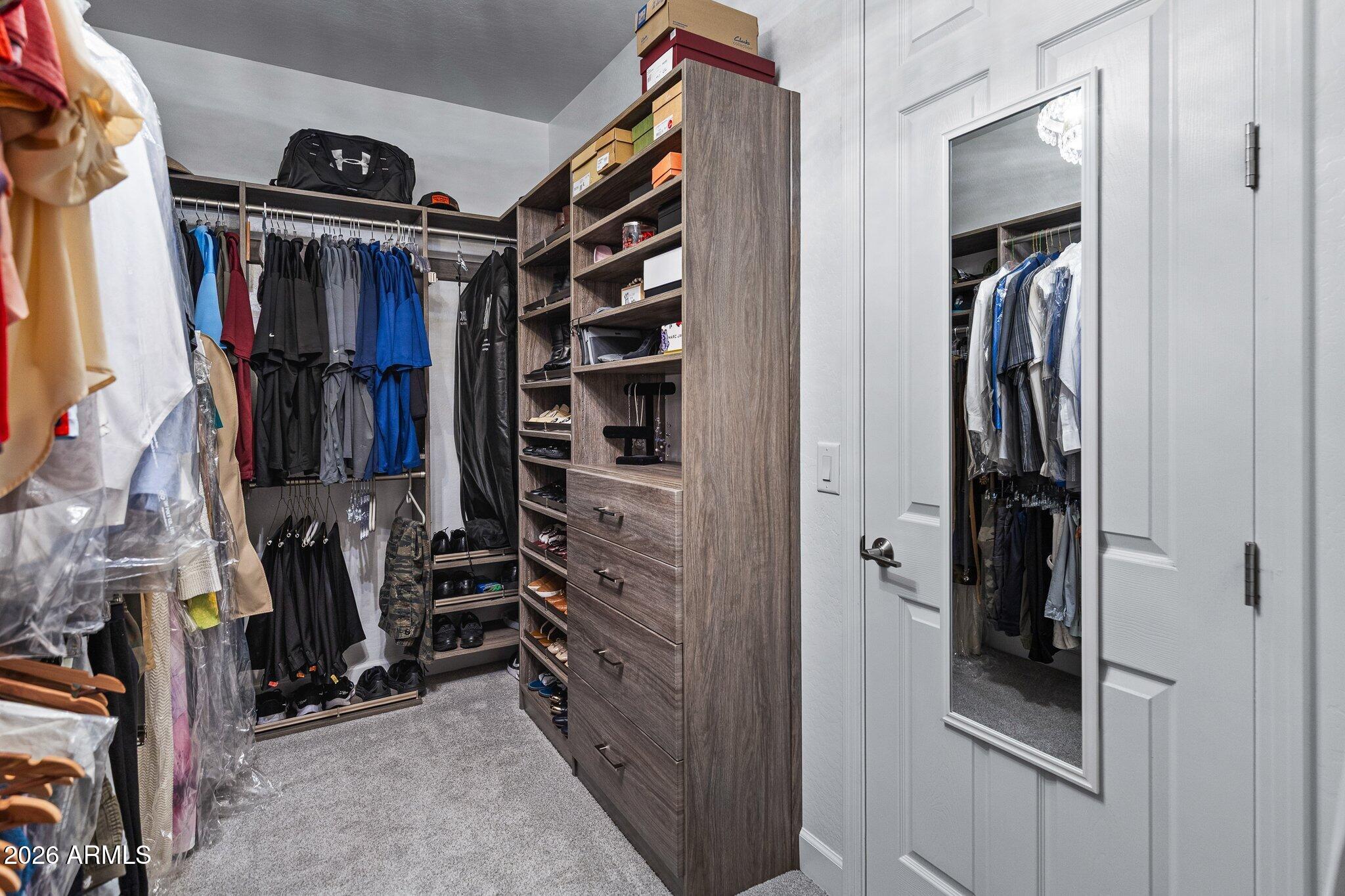 16897 West Almeria Road Goodyear, AZ 85395 - Photo 29 of 51 Organized Primary Closet