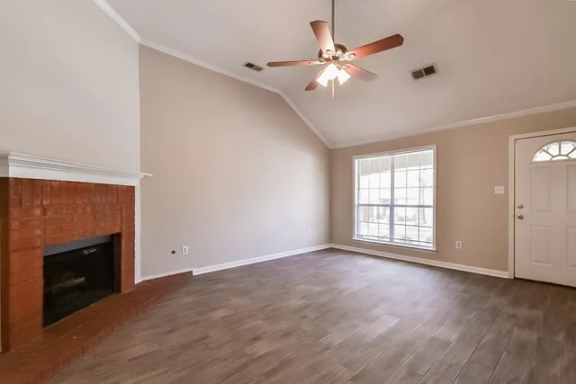 a picture of a bench in front of a wall