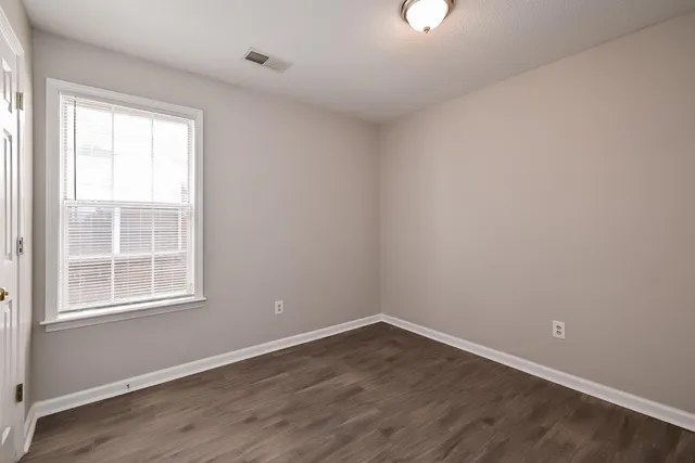 a bathroom with a sink vanity and a mirror