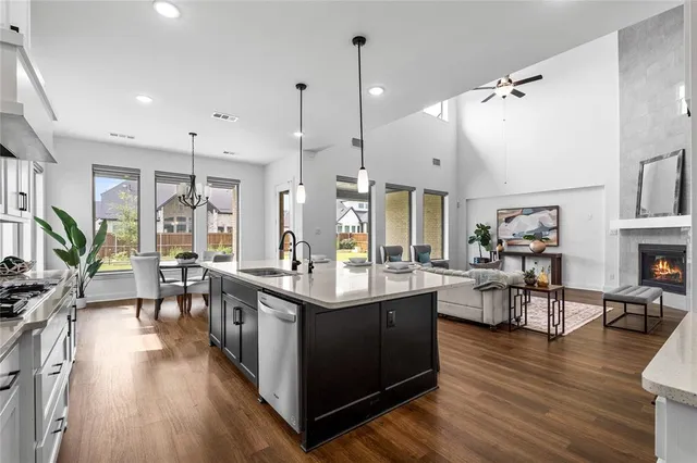 a kitchen with lots of counter top space and a wooden floor