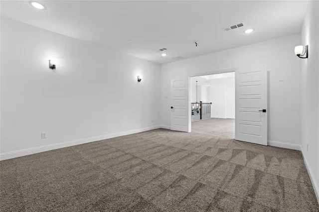 an empty room with closet and a window