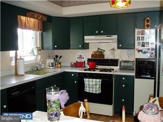94 Democrat Road Mickleton, NJ 08056 - Photo 3 of 12 a kitchen with a sink cabinets and window