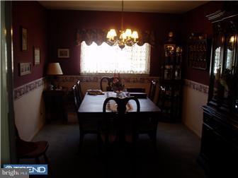 94 Democrat Road Mickleton, NJ 08056 - Photo 5 of 12 a living room with furniture a floor to ceiling window and a potted plant