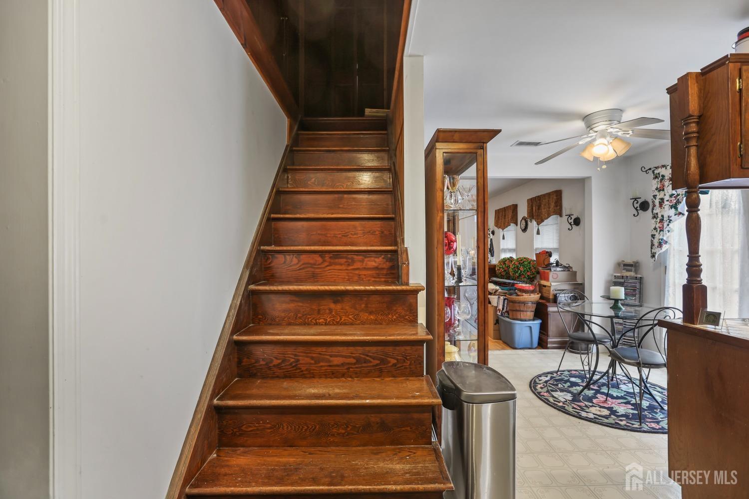 75 Baird Road Millstone Township, NJ 08535 - Photo 11 of 30 a view of entryway and livingroom with wooden floor