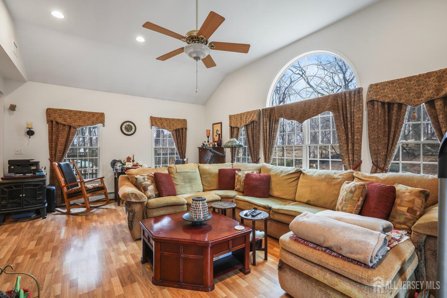 75 Baird Road Millstone Township, NJ 08535 - Photo 13 of 30 a living room with furniture and a large window
