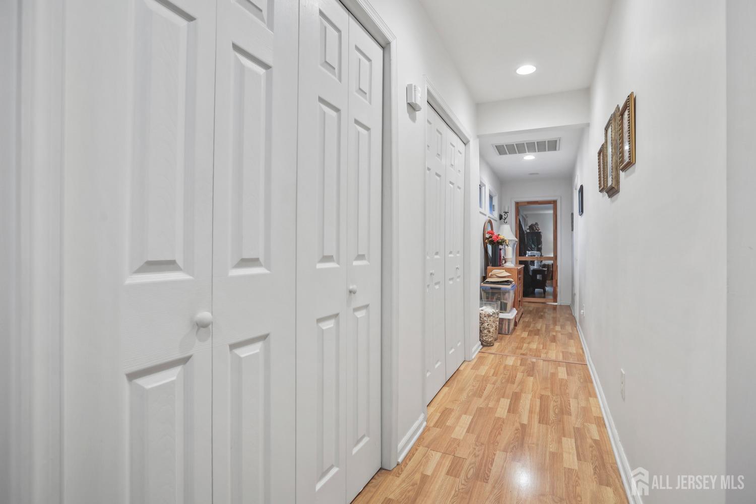 75 Baird Road Millstone Township, NJ 08535 - Photo 15 of 30 a view of a hallway with wooden floor and entryway
