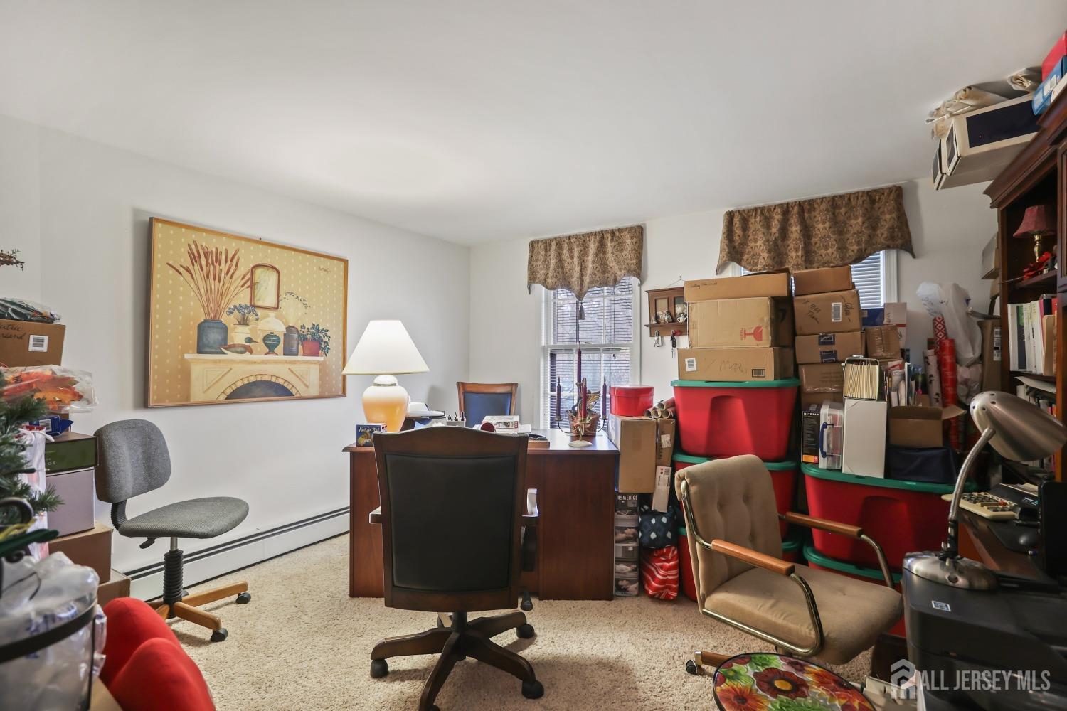 75 Baird Road Millstone Township, NJ 08535 - Photo 17 of 30 a work room with furniture and a workspace