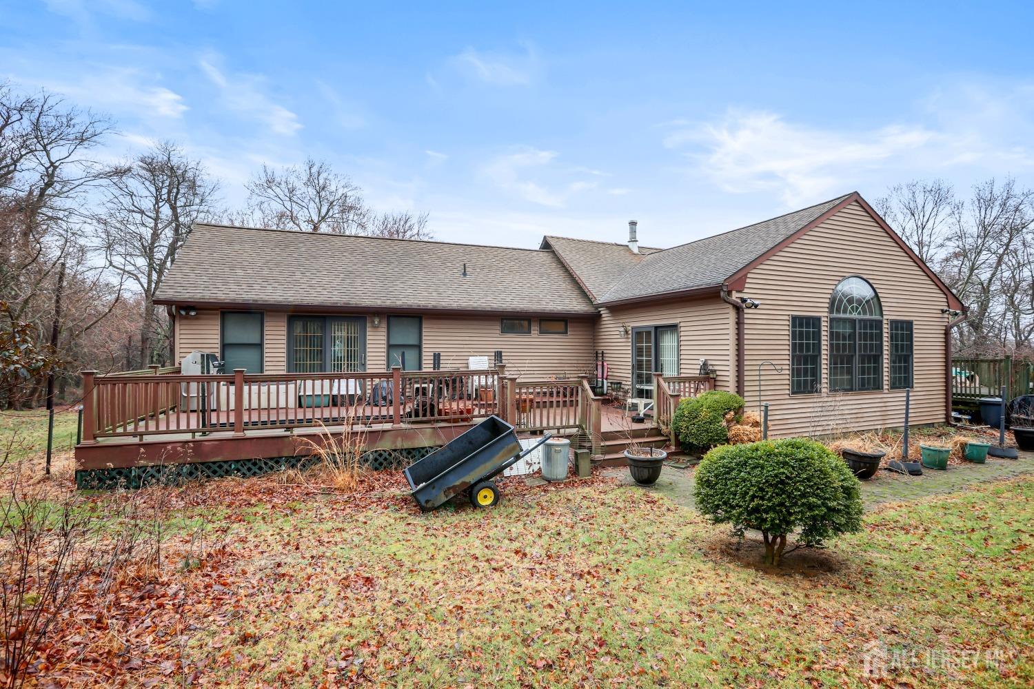 75 Baird Road Millstone Township, NJ 08535 - Photo 19 of 30 a front view of a house with a yard and outdoor seating