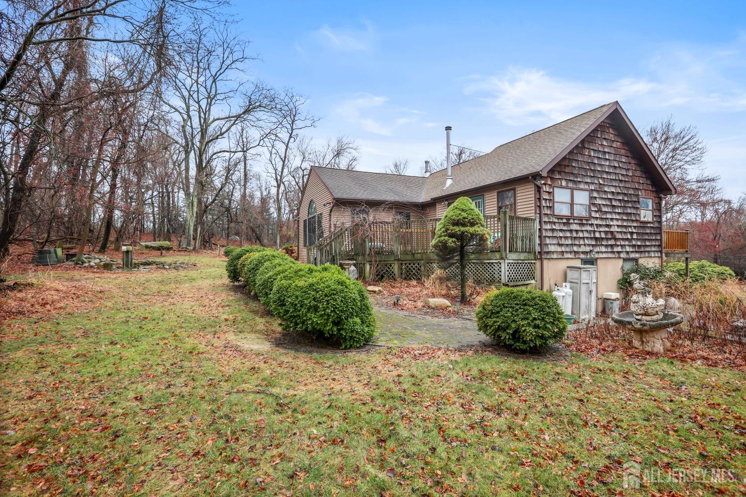 75 Baird Road Millstone Township, NJ 08535 - Photo 20 of 30 a view of a back yard with potted plants