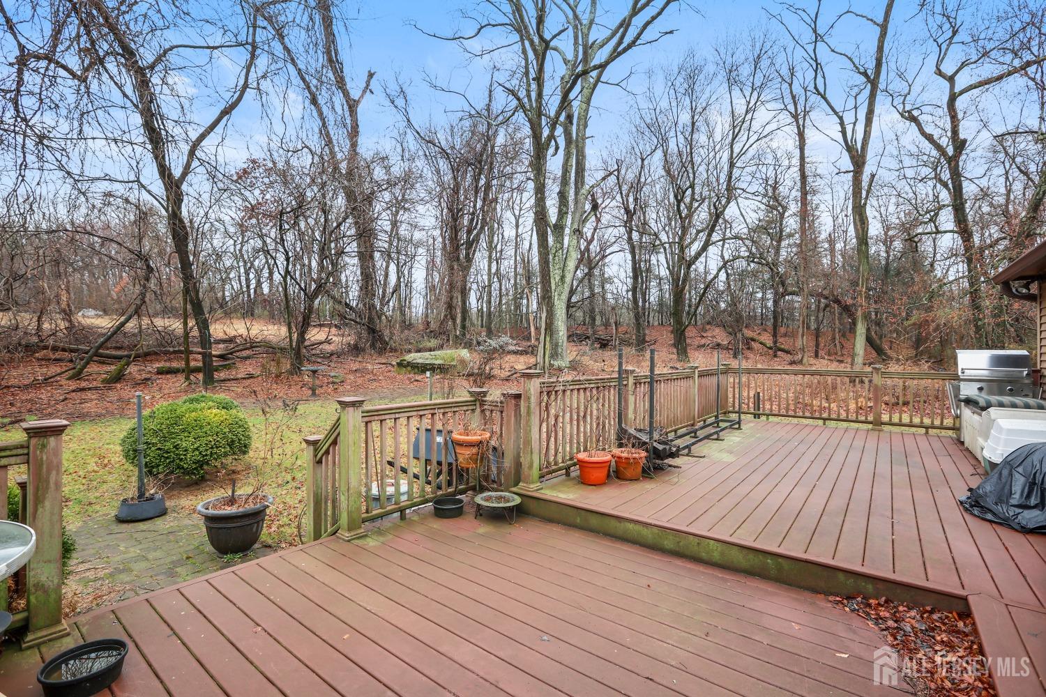 75 Baird Road Millstone Township, NJ 08535 - Photo 21 of 30 a view of a deck with couches and wooden floor